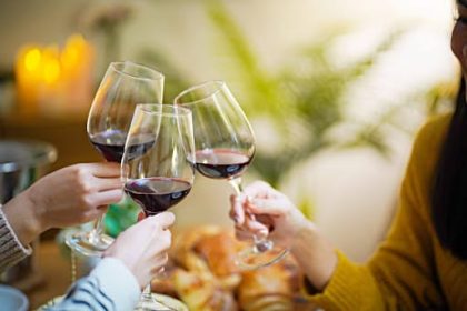 cheerful-friends-enjoying-home-birthday-holiday Wine Supplier Singapore | Wine Shop Singapore